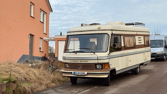 Burgstall, Germany - Vintage mobile home parked on a street.