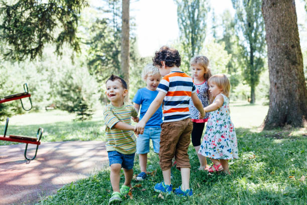 istock Children playing in the park 2005404364