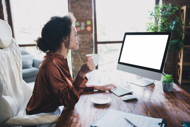 istock Profile portrait of elegant recruiter lady sit chair hold coffee mug keyboard write empty space screen workplace indoors 2005410268