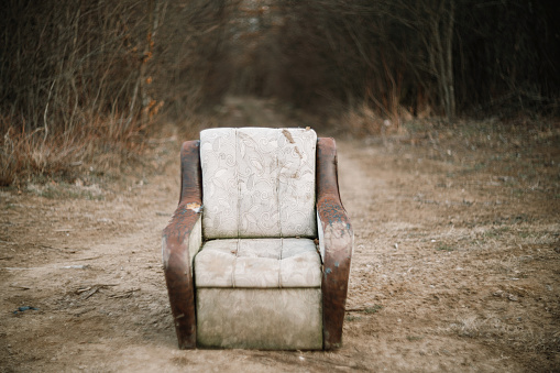 Old chair left and abandoned in the middle of nowhere
