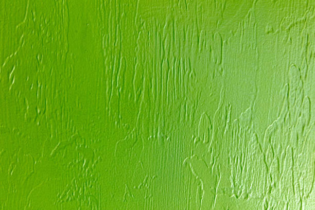 Green wall texture. Green paint on the wall. Abstract background for design.