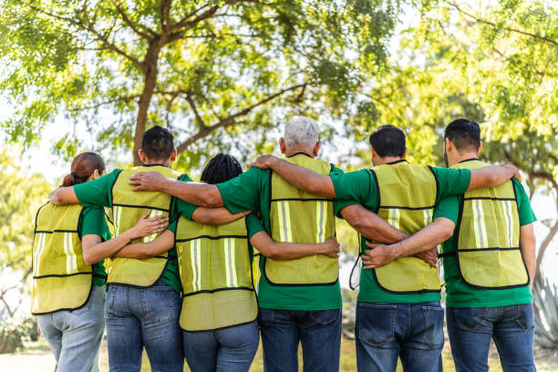 istock Recyclers embraced on public park 2005453877