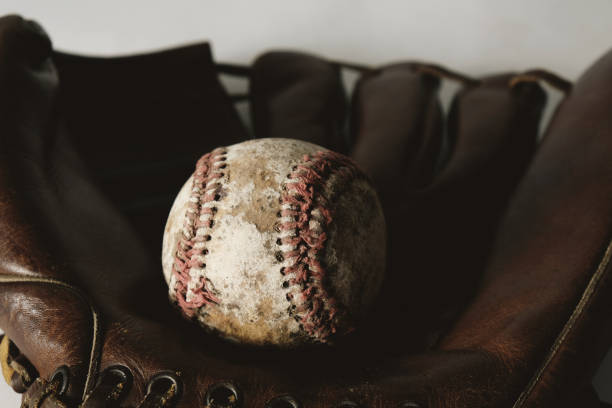 istock Vintage baseball in old glove 2005462510