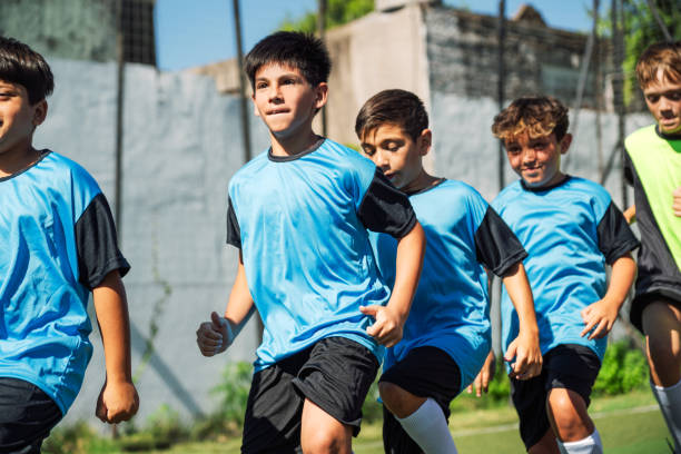 istock Youth Soccer Players Running Together During Training Session 2005474623