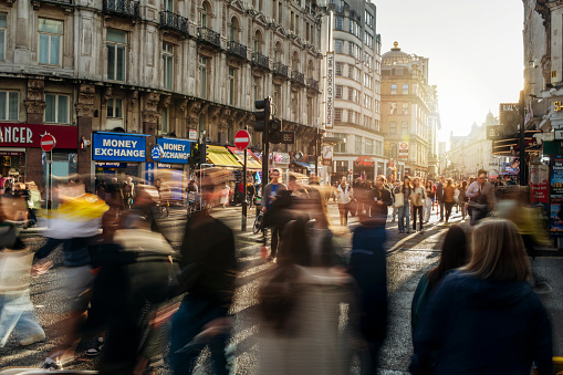 Blurred motion of people walking on the big city streets on rush hour.