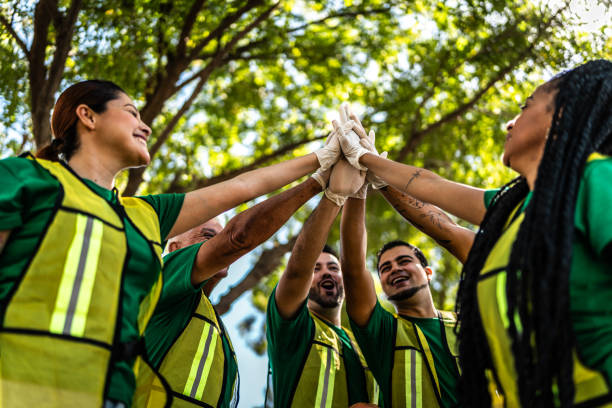 istock Recyclers doing high-five after cleaning the public park 2005478852