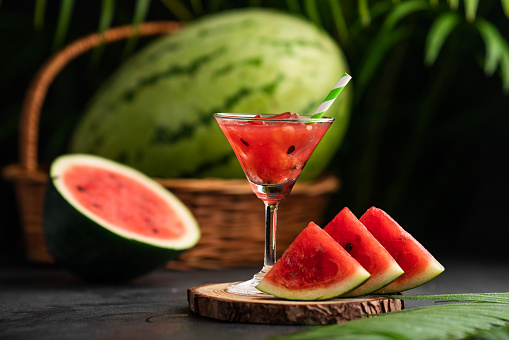 Fresh watermelon slices with watermelon smoothie, Summer drinks background