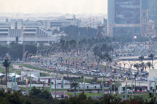 Doha, Qatar  - February 11, 2024: Traffic on the corniche road in Doha. Middle East