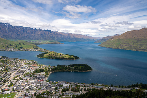 Experience Queenstown's enchanting waterfront, where boats, restaurants, and stunning lakeside views create a picturesque setting in New Zealand.