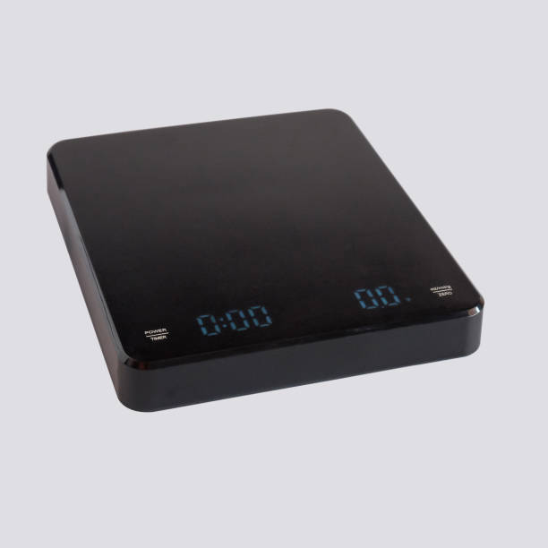 istock Black digital weighing scale for coffee beans measure. 2005494531