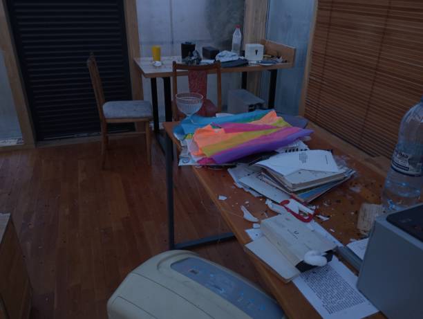 istock A mess in the room. Things are scattered chaotically in a dirty, untidy room. Many different things are chaotically on the table. 2005496111