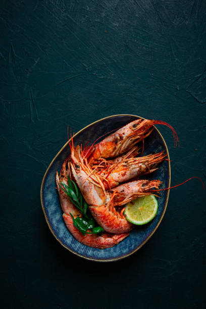 istock Langoustines, Australian, freshly frozen on ice, top view, lime and greens, 2005496121