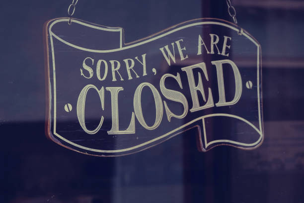 istock Sorry We Are Closed Store Sign On a Window Door 2005503173