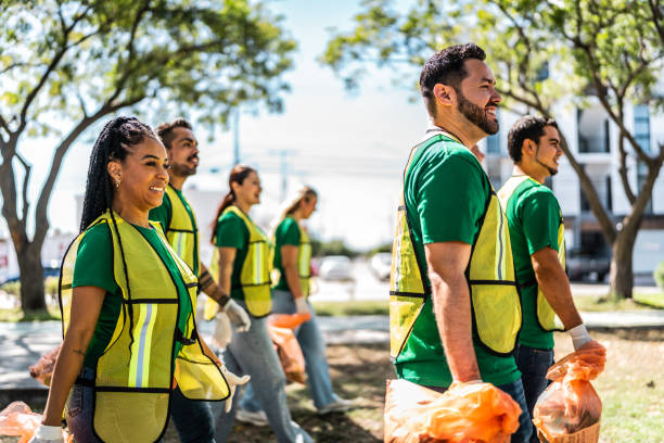istock Recyclers collecting trash from the public park 2005504238