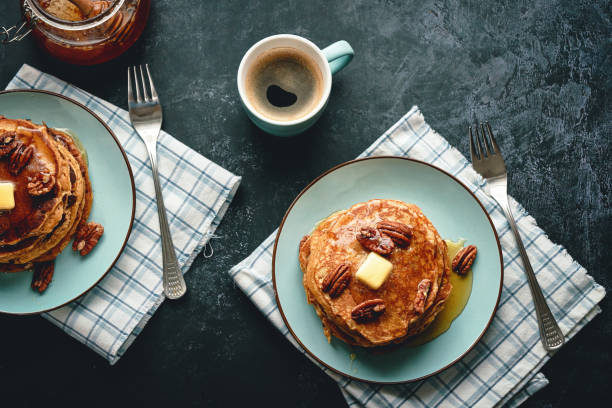 Stack of Sweet Potato Pancakes with Butter and Pecan Nuts