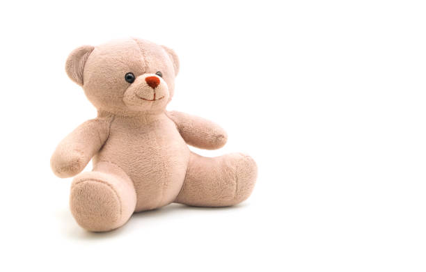 istock Brown teddy bear doll smiling and sitting on white background 2005506960