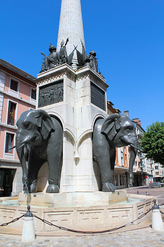 View of the Statue of 4 elephant on a sunny day. Close-up. Chambery. France.