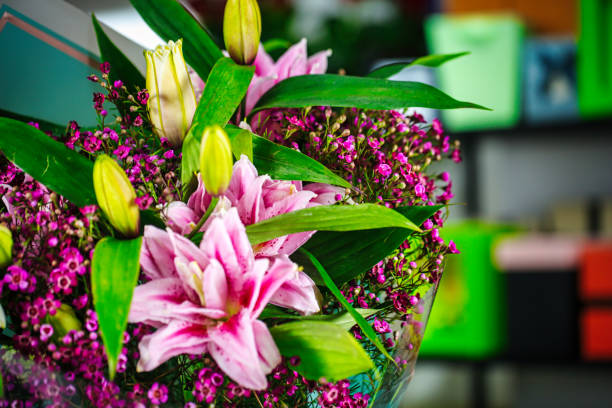 A vase filled with lots of pink flowers, providing a beautiful display of natures vibrant colors.