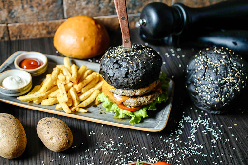 A plate showcasing a mouthwatering burger and golden french fries.