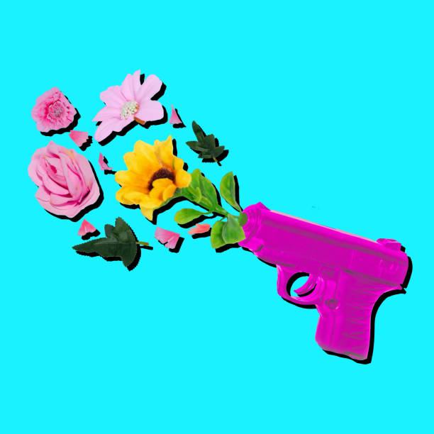 istock Pistol shooting flowers creative design concept. 2005596971