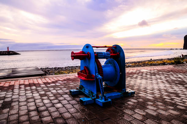 Old Vintage Metal Winch in a Port Harbor