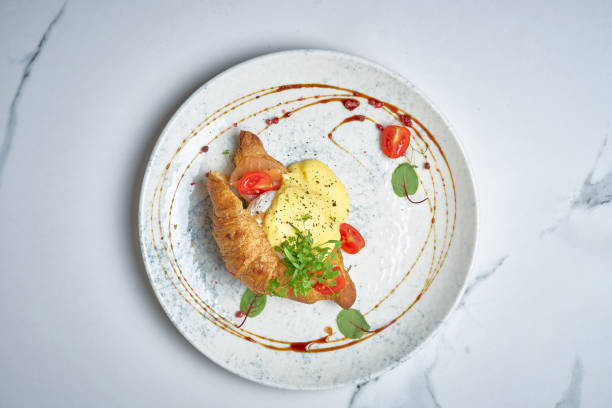 istock Croissant with poached egg and hollandaise sauce 2005637224