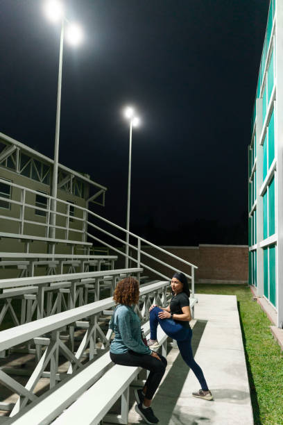 istock Two young women embrace evening exercise 2005701175