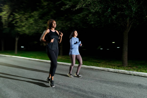 istock Two best friends go on a post-school park jog 2005705409
