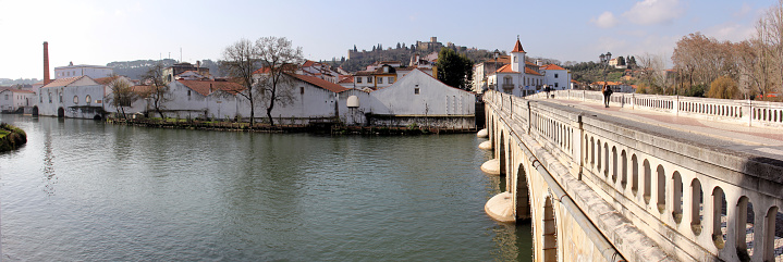 Nabanus River, South of The Old Bridge, Ponte Velha, view of the former industrial district on the right bank of the river, panoramic shot, Tomar, Portugal