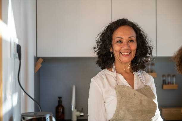 Senior woman in the Kitchen stock photo