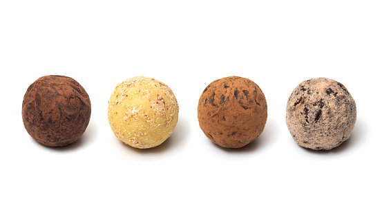 Collection of chocolates. Belgian truffles on a white background.