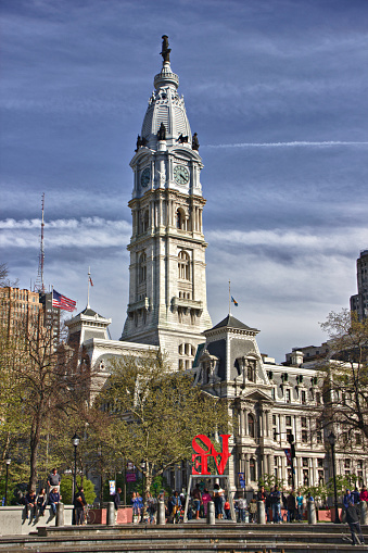 Soaring 548 feet above Center City Philadelphia, City Hall is here seen from John F. Kennedy Plaza. 

The plaza is colloquially known as “Love Park,” because of the iconic “LOVE” sculpture by Robert Indiana in the southeast quadrant of the park.