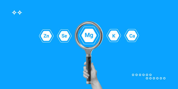 istock Magnesium concept. Search for products or dietary supplements with high magnesium content. Hand with a magnifying glass and icons of other minerals and micronutrients around. Minimalist art collage 2005764933