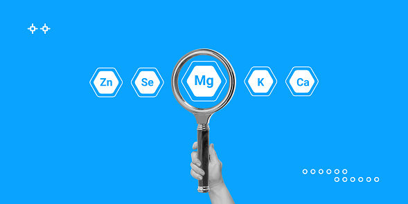 Magnesium concept. Search for products or dietary supplements with high magnesium content. Hand with a magnifying glass and icons of other minerals and micronutrients around. Minimalist art collage.