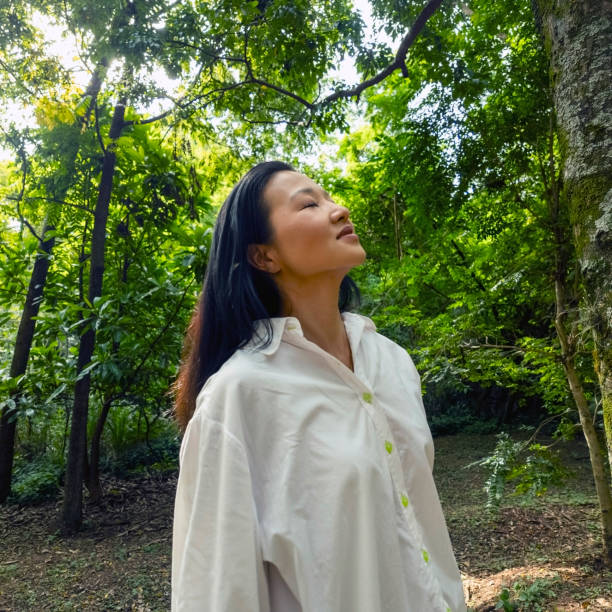 istock Japanese woman in a tree area. 2005768088