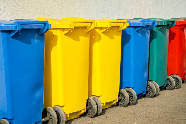 istock Colored plastic bins for sorting garbage in the office backyard, recycling 2005811118