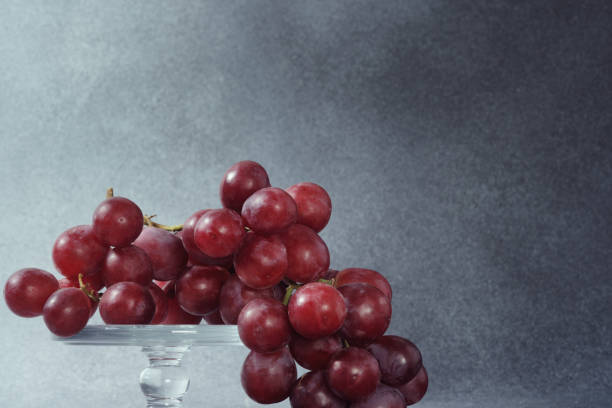 Grapes in vase isolated on white background with cut out space for text.