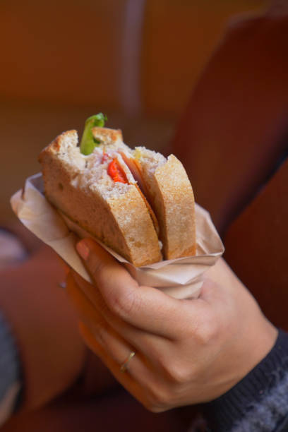 istock women hand pick Sandwich with ham, cheese, tomatoes,, 2005831504