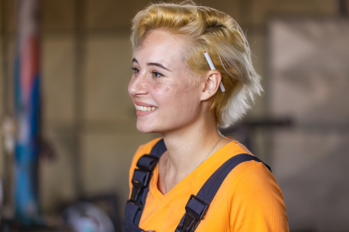 Portrait of an young Caucasian female metal worker