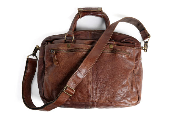 istock Brown briefcase bag with shoulder strap made of rough buffalo leather isolated on white background 2005861810