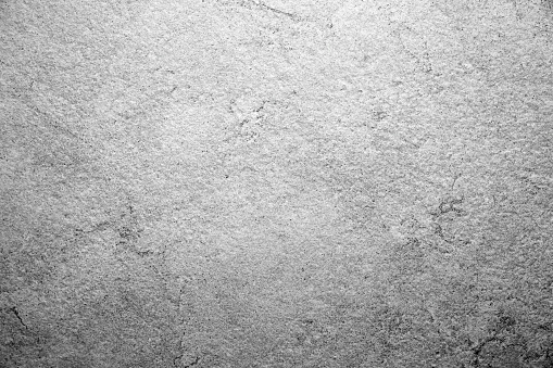 Black and white background or stone texture. The surface of an old stone.