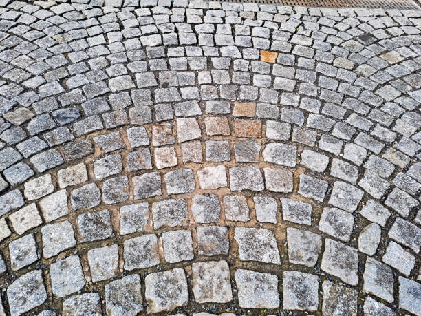 istock Grey brick pavement background close up. Gray stone tile block background 2005864838