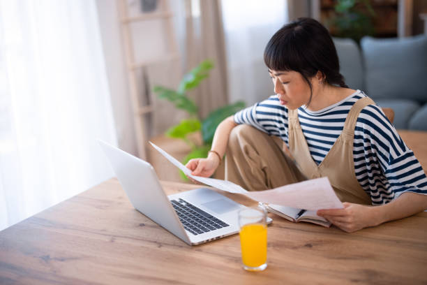 istock Japanese stylish woman using laptop at home 2005868017