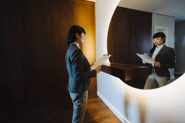 One woman, rehearsing a speech in  mirror at home.