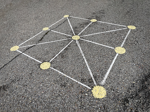 tic-tac-toe game board painted on the asphalt of a street, street games, popular games, horizontal