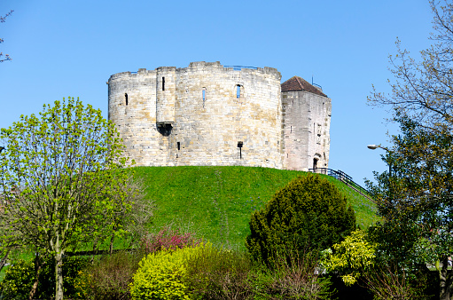 The historic charm of this ancient city with its well-preserved medieval architecture, narrow cobblestone streets, river, city walls and the iconic York Minster. The scene captures the essence of this quintessentially English city, rich in history and steeped in culture.