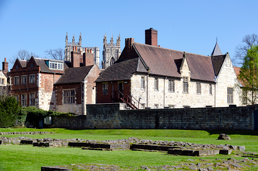 The historic charm of this ancient city with its well-preserved medieval architecture, narrow cobblestone streets, river, city walls and the iconic York Minster. The scene captures the essence of this quintessentially English city, rich in history and steeped in culture.