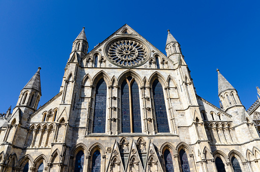 The historic charm of this ancient city with its well-preserved medieval architecture, narrow cobblestone streets, river, city walls and the iconic York Minster. The scene captures the essence of this quintessentially English city, rich in history and steeped in culture.