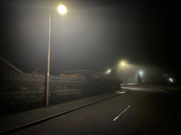 Empty street on foggy night
