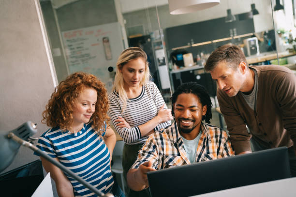 istock Business solutions, technology and strategy concept. Colleagues working and brainstorming in office 2005947111